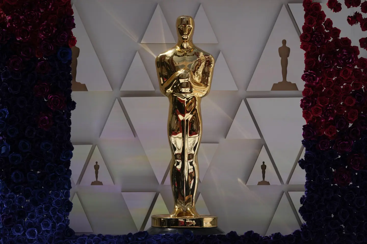 An Oscar statue sparkles in sunlight on the red carpet ahead of Sunday's 94th Academy Awards in the Hollywood section of Los Angeles, Saturday, Mach 26, 2022. (AP Photo/Jae C. Hong).
