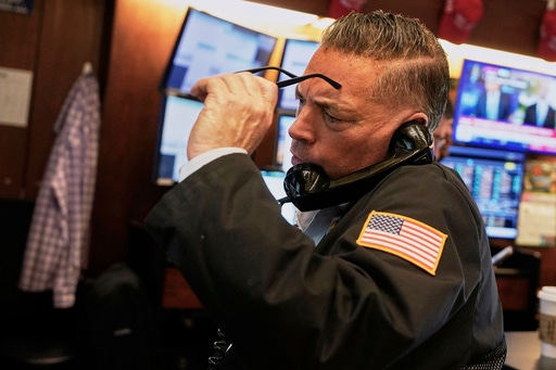 Trader Jonathan Mueller works on the floor of the New York Stock Exchange, Thursday, April 10, 2025. (AP Photo/Richard Drew)