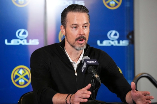 Denver Nuggets team president Josh Kroenke responds to questions at a news conference Monday, April 14, 2025, in Denver about the firing of the team's general manager and head coach last week. (AP Photo/David Zalubowski)