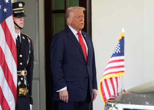 President Donald Trump waits to greet El Salvador's President Nayib Bukele at the White House, Monday, April 14, 2025, in Washington. (AP Photo/Manuel Balce Ceneta)