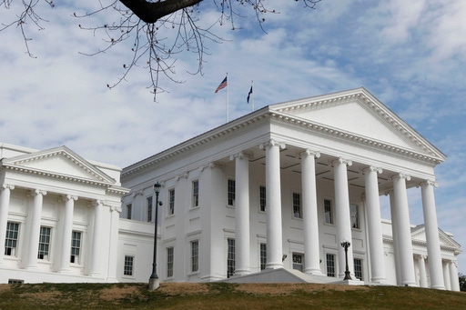 FILE - Flags wave on the roof of the State Capitol in Richmond, Va. Feb. 26, 2011. (AP Photo/Steve Helber, File)